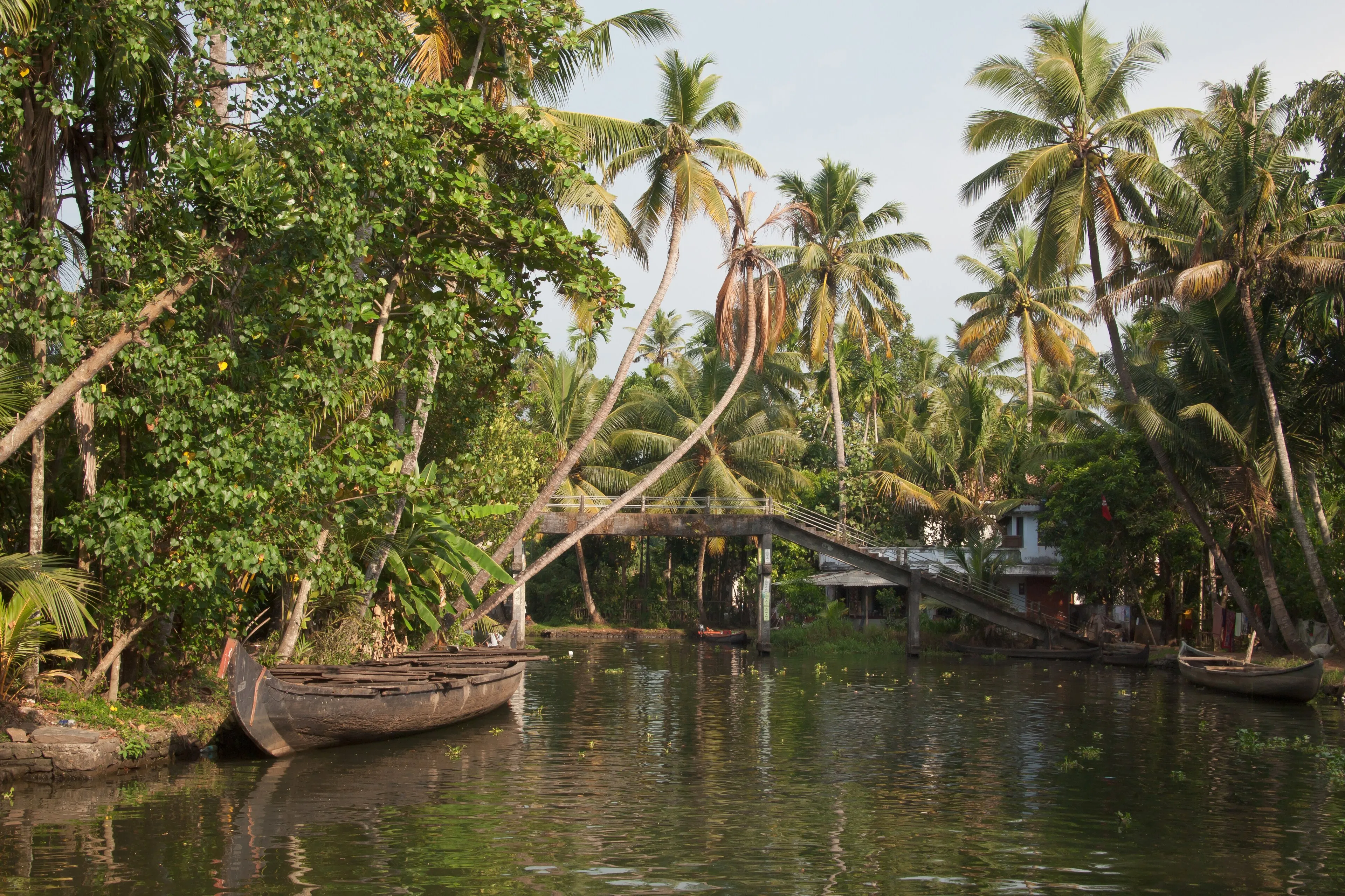 The teak-panelled living and dining area aboard a CeePee houseboat