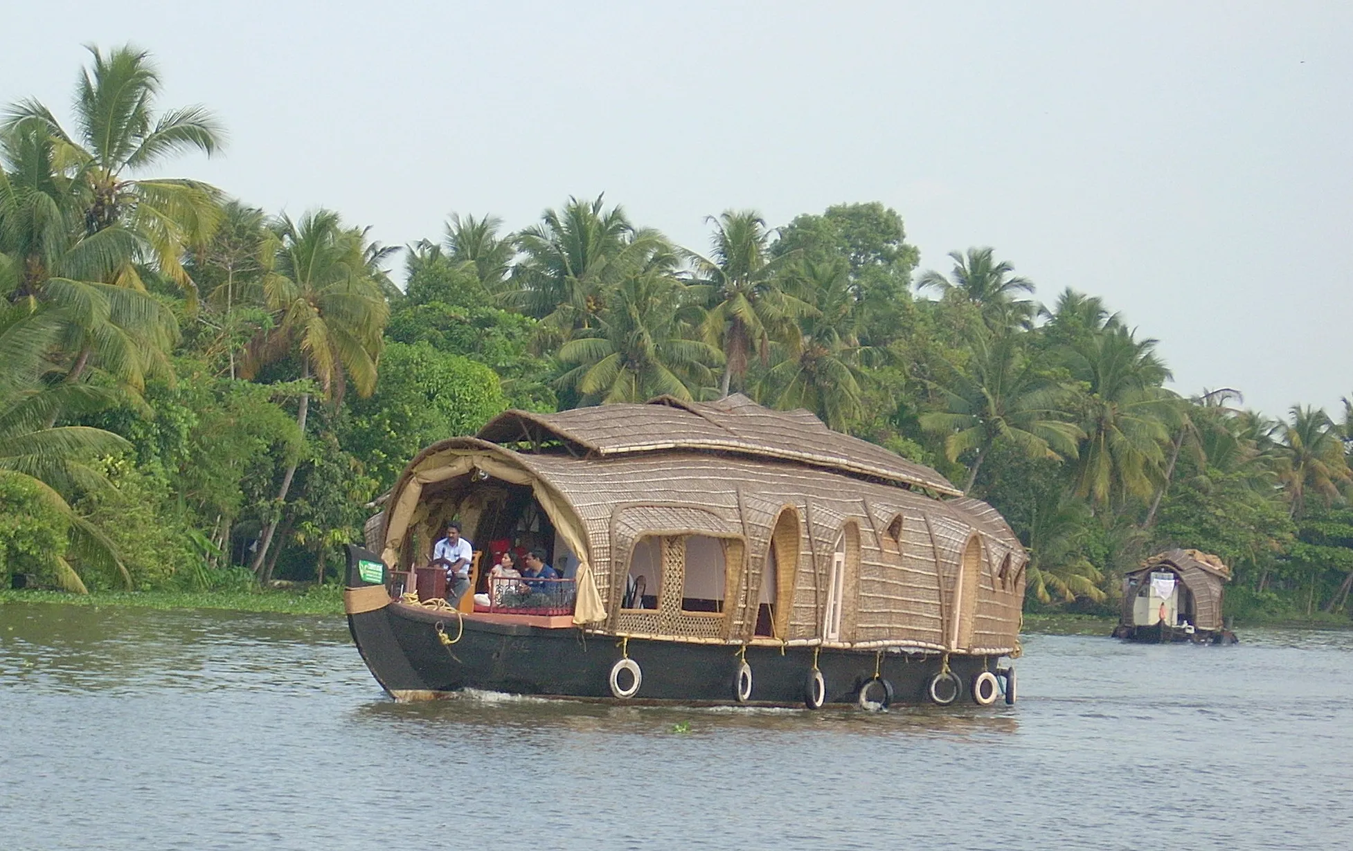 A welcome drink of tender coconut water on a houseboat table